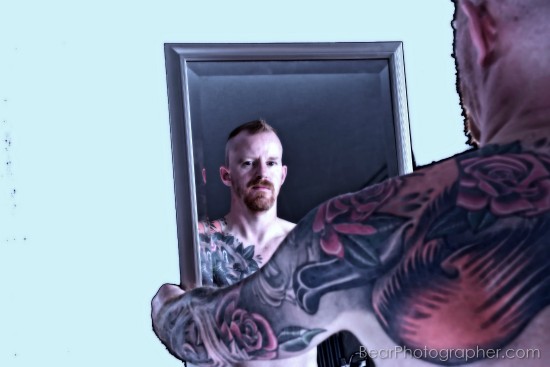 Tattoos on red haired man skin - strong male photography