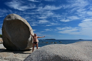 Catalan muscle bear in the rocks at the beach